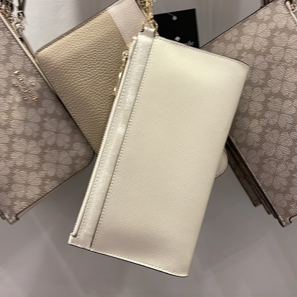 Kate Spade Madison Double Zip Wristlet Wallet Phone Case
Meringue
NWT - Picture 16 of 16